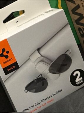 Spigen White Visor Sunglass Holder with Orange Pull Tab